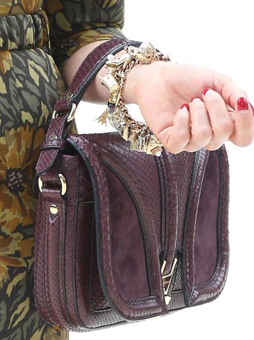 Close-up of Dita von Teese's luxurious and exotic Bordeaux handbag, a statement piece that showcases her unique style, captured at London Fashion Week