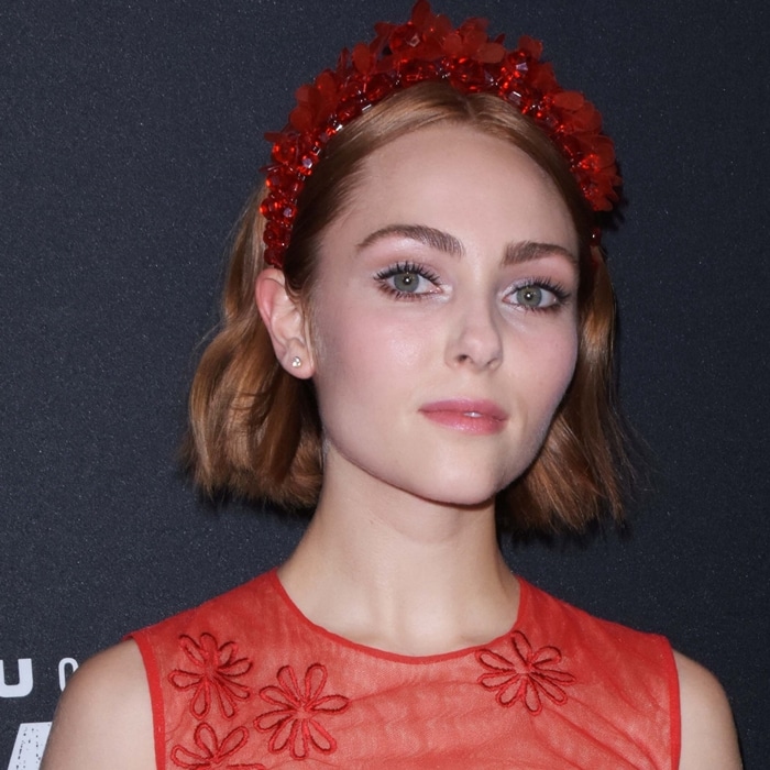 AnnaSophia Robb wears a paillette-adorned headband