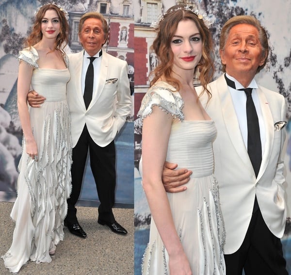 Anne Hathaway and Valentino Garavani pose for photos in matching neutral ensembles