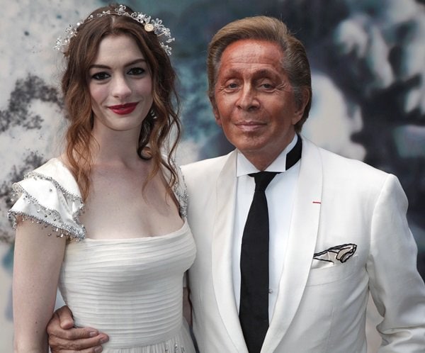 Anne Hathaway and Valentino Garavani pose for photos at The White Fairy Tale Love Ball