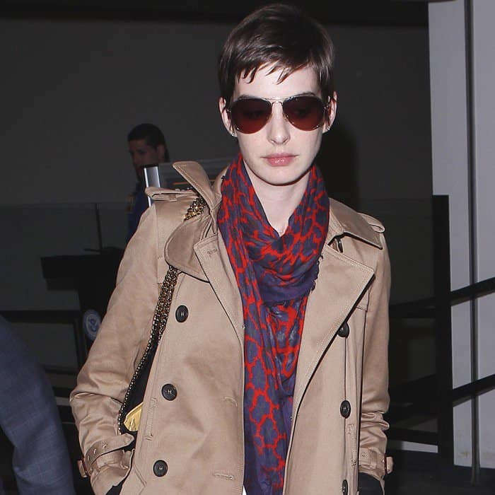 Anne Hathaway wears a red and blue printed scarf from Christopher Kane