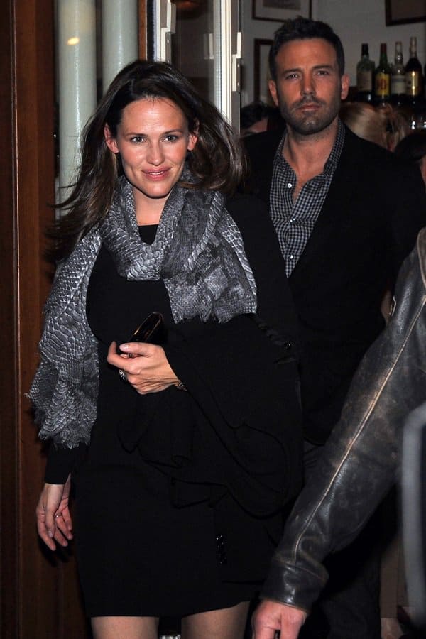Jennifer Garner showcased her flair for fashion with a striking python-printed scarf while out in Paris with Ben Affleck on October 15, 2012, adding an exotic touch to her elegant ensemble