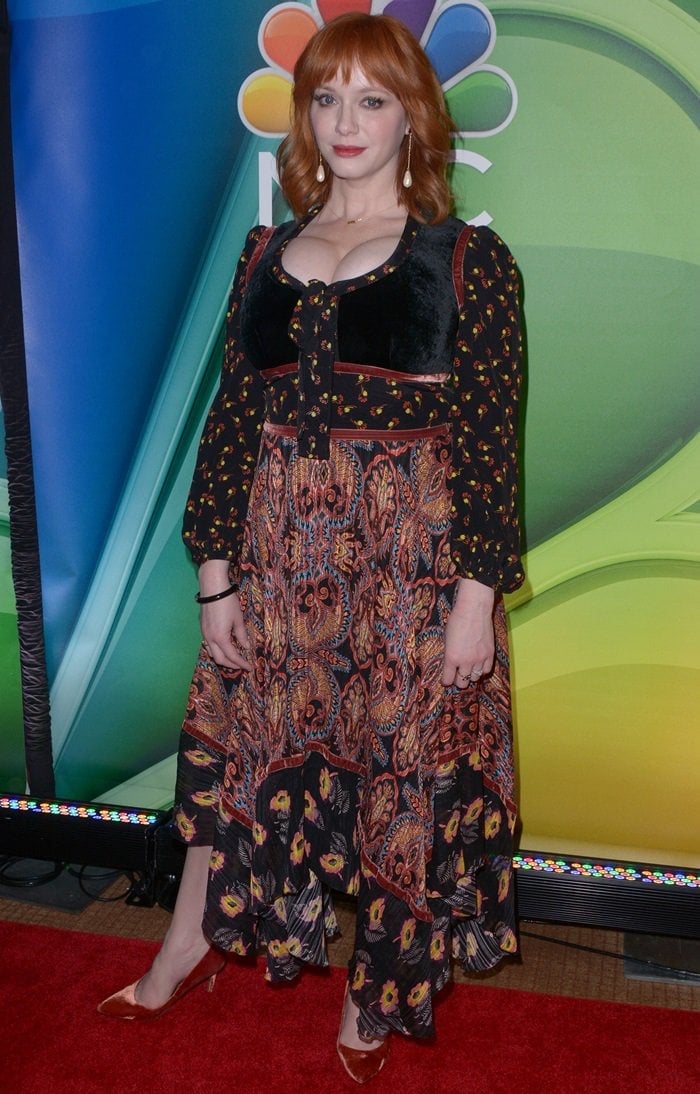 Christina Hendricks' printed long sleeve silk asymmetrical dress