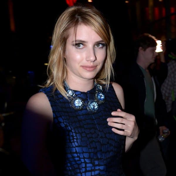 Emma Roberts showcases her style in a monochromatic Armani Exchange dress at the Staples Center