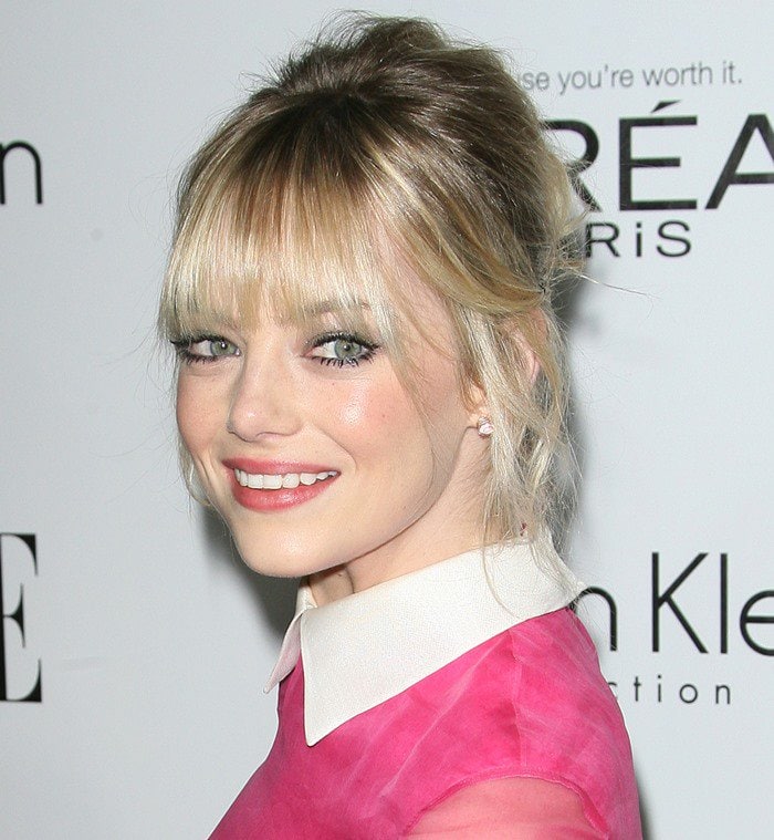 Emma Stone shows off the crisp white collar of her retro pink Valentino dress