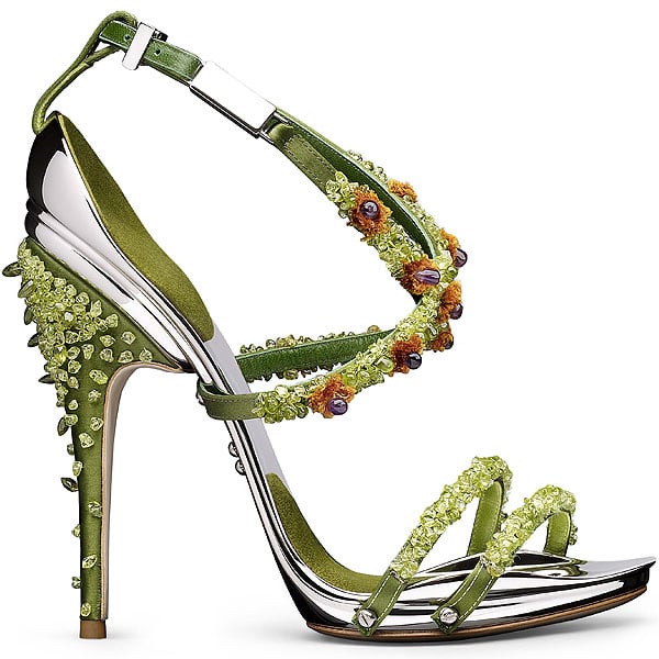 The Poisonneuse sandal dazzles in acid green satin, embellished with clustered crystals, beaded florets, and a spiked heel that evokes botanical danger
