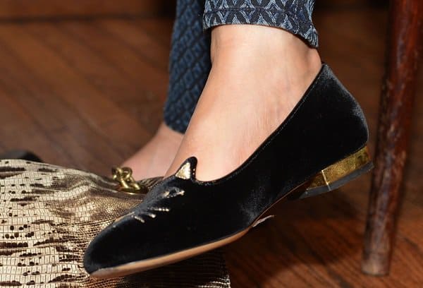 A detailed view of Gina Gershon's elegant Charlotte Olympia Cat Face flats