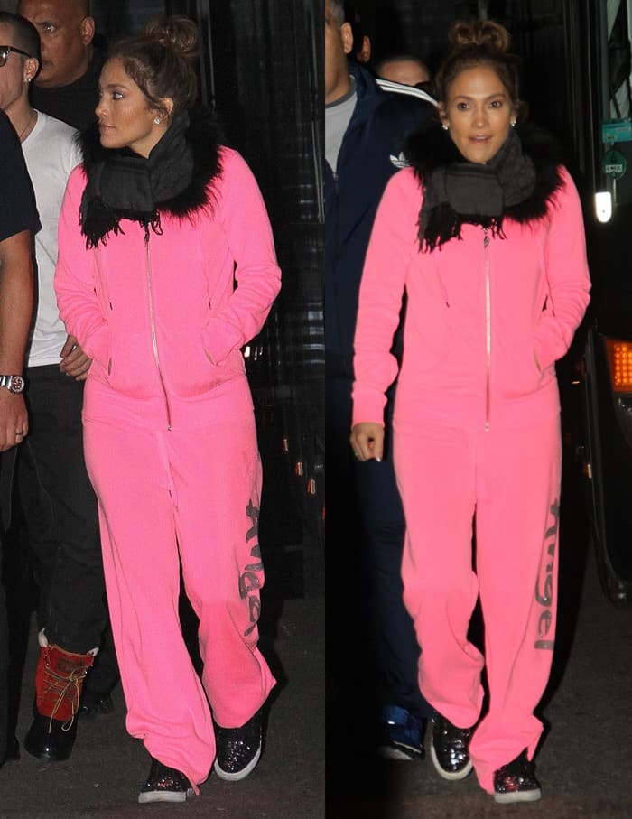 Jennifer Lopez adds a touch of pink to her post-concert ensemble with a cozy tracksuit and scarf combination