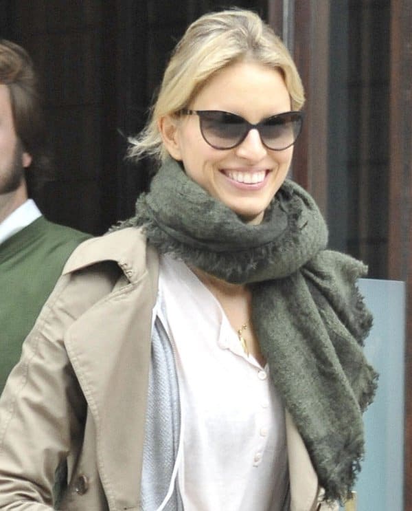 Karolina Kurkova tops her workout wear with a trench coat and a scarf to beat the fall weather and keep herself warm