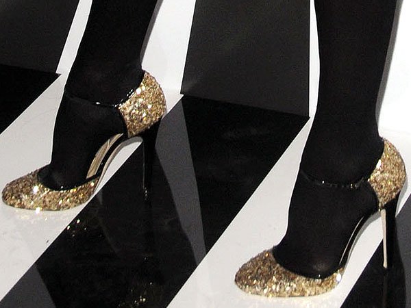 Kelly Bensimon in black stockings and Sequins heels