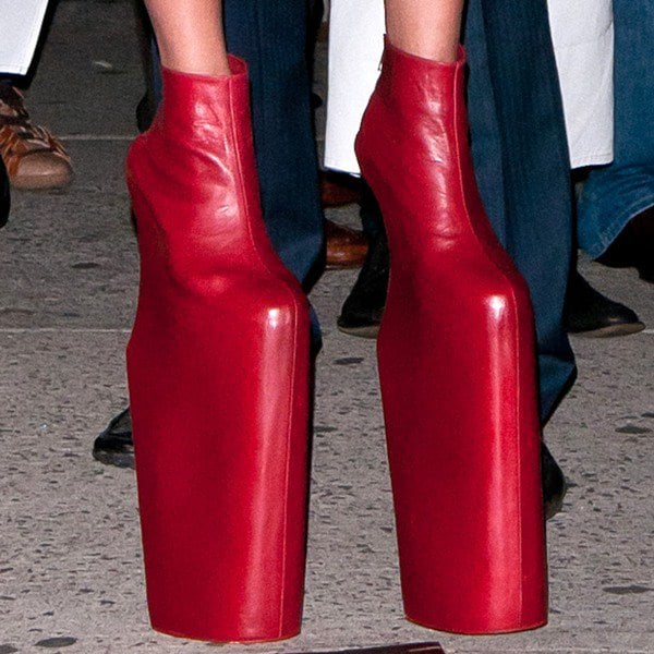 Lady Gaga wearing extreme red curved-heel wedges