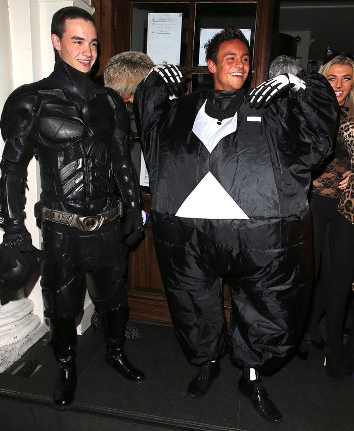 Liam Payne, as Batman, and Tom Daley, in a fat skeleton costume, bring humor and heroism to a Halloween party at Funky Buddha nightclub in London, England, on October 28, 2012