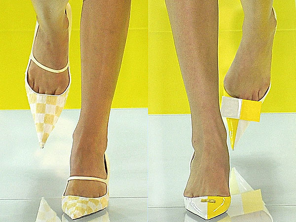 Models strut in checkered pointy toe shoes down the Louis Vuitton Spring/Summer 2013 runway