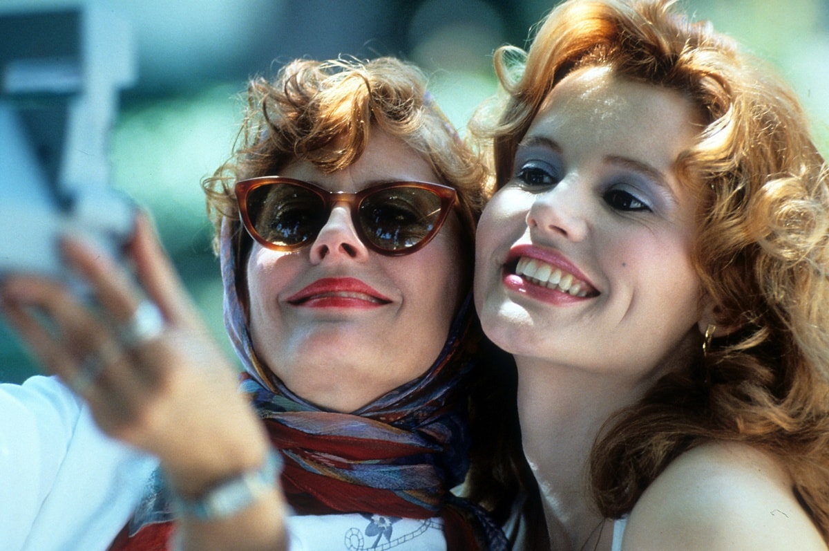The iconic Polaroid shot of Louise (Susan Sarandon) and Thelma (Geena Davis) with the headscarf plus sunglasses combo