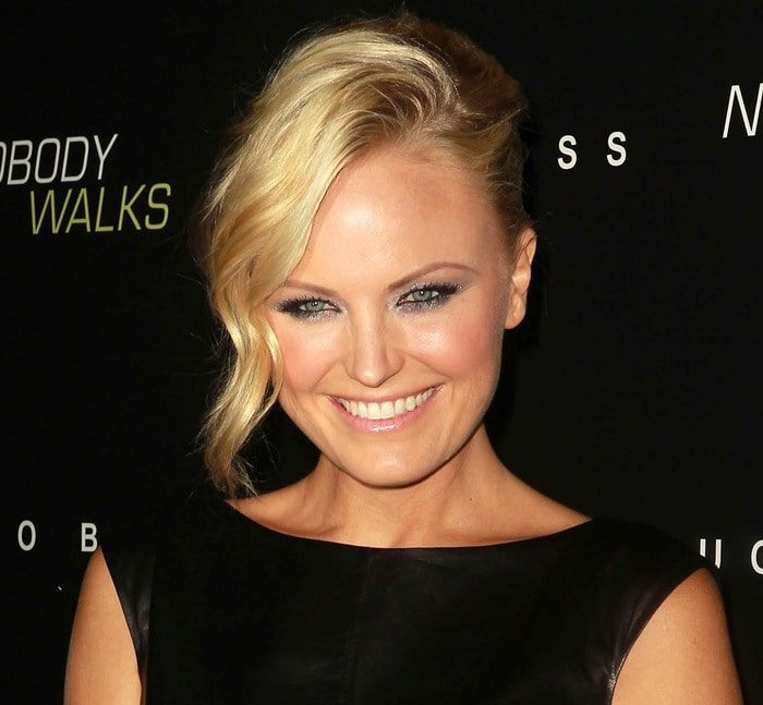 Malin Akerman sweeps her hair to the side for the premiere of "Nobody Walks"