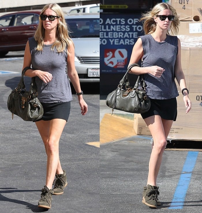 Nicky Hilton wears Isabel Marant wedge sneakers with a black mini skirt and a gray t-shirt