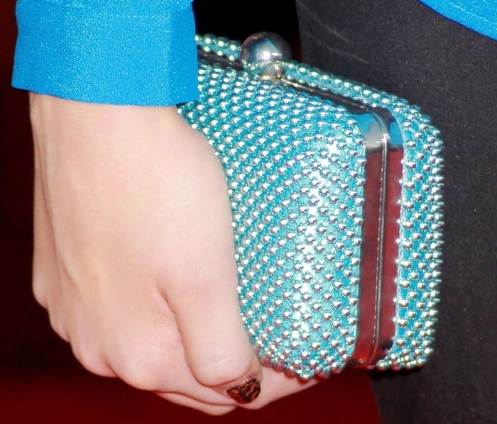 Peyton List shows off her Charming Charlie clutch