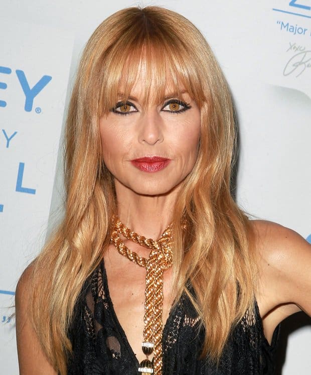 Elegance personified: Rachel Zoe in a black lace dress and her signature gold tasseled necklace at the Jockey collection launch, Sunset Tower Hotel, October 17, 2012