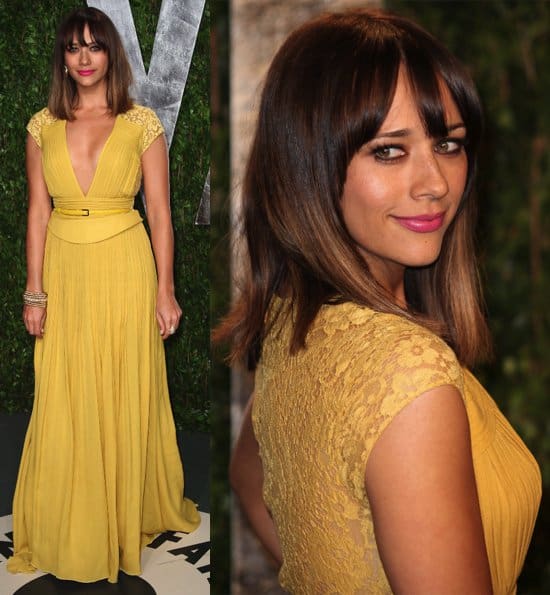 Rashida Jones wore a yellow dress by Elie Saab featuring a deep V-neckline, subtle pleats, and lace details on the shoulders