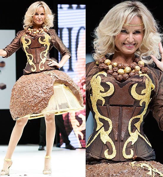 Adriana Karembeu models a stunning ensemble featuring a crispy chocolate ball skirt paired with a delicate chocolate wafer bodice, accentuated by a matching necklace.
