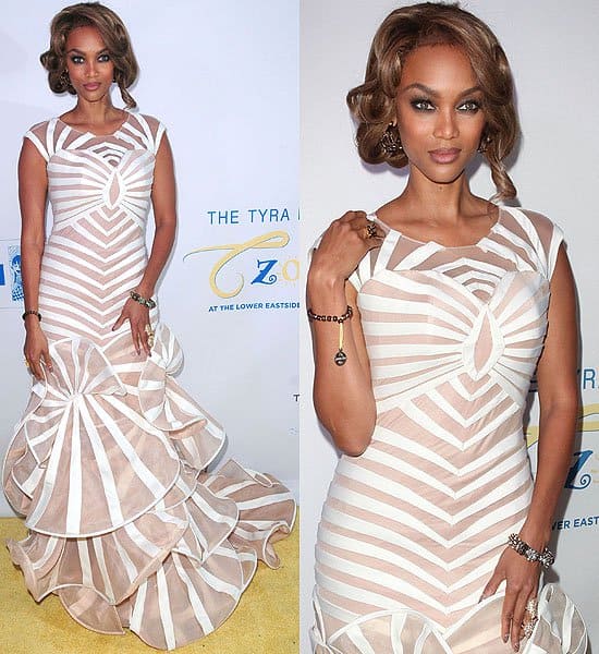 Tyra Banks elegantly arrives at The Flawsome Ball, showcasing a breathtaking white and nude mermaid gown designed by Francis Libiran, in New York City on October 18, 2012