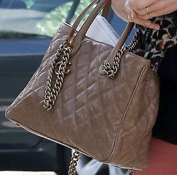 Zoomed-in view of January Jones' chic Chanel Shiva tote, her stylish companion during a grocery run at Whole Foods