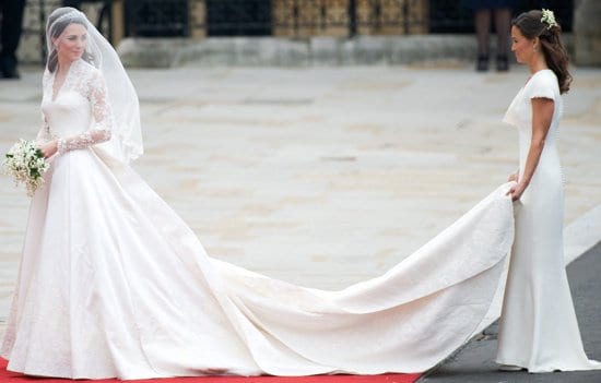 Kate Middleton arrives for her wedding with Britain's Prince William as her maid of honor, Pippa Middleton holds the train at Westminster Abbey in London