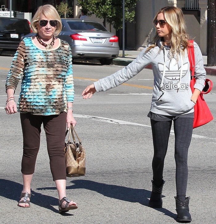 Ashley Tisdale steps out with her mom, Lisa Tisdale, in Studio City on November 6, 2012, rocking an Adidas hoodie, Falmer cable leggings, and Koolaburra Talia studded boots, while adding a bold touch with her Givenchy Nightingale tote