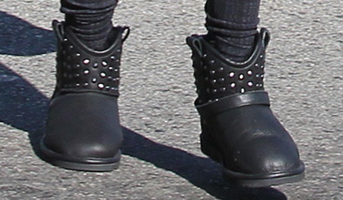 Ashley Tisdale pairs her cozy leggings with edgy black studded ankle boots