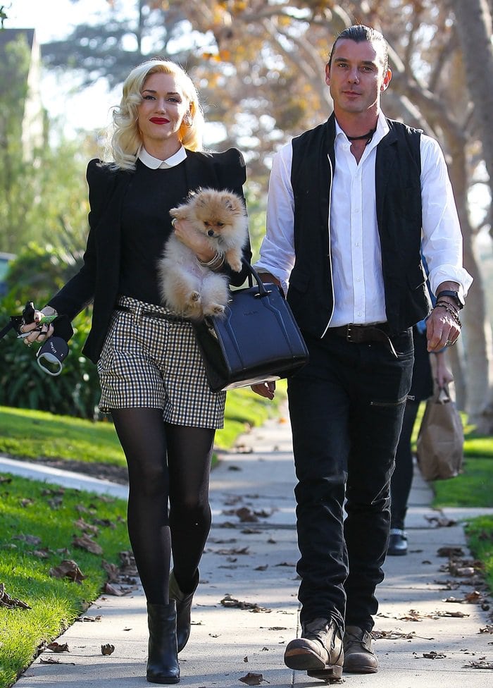 Gwen Stefani celebrated Thanksgiving in Los Angeles on November 22, 2012, sporting opaque control top tights, a Thierry Mugler Agent handbag, and a structured blazer by the same designer