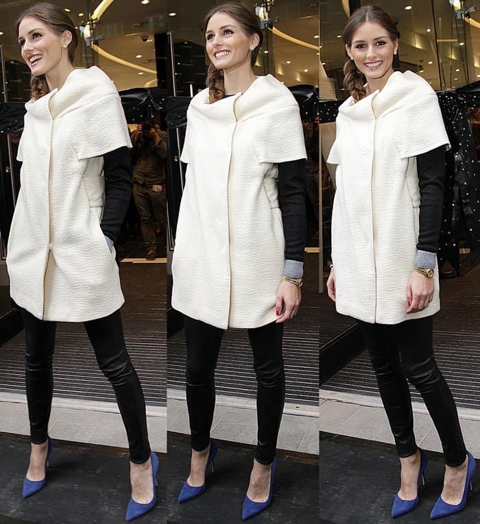 Olivia Palermo shows how to wear leather pants with a short cream coat dress