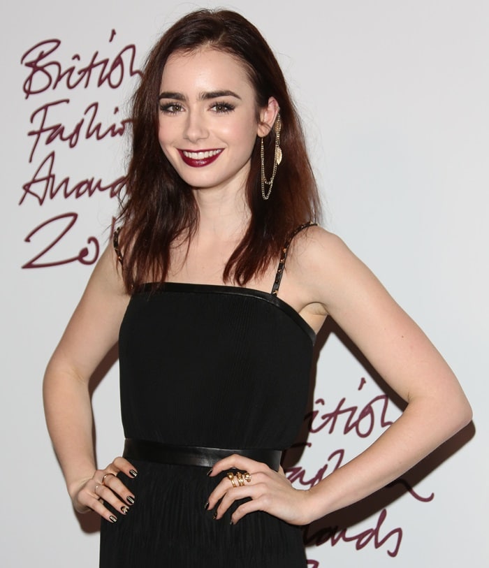 At the British Fashion Awards in London on November 27, 2012, Lily Collins looked elegant in a Mulberry Long Eliza dress, complemented by an Alexander McQueen Flower Ottone Skull ring