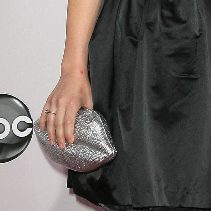 Lucy Hale's glittering lips-embellished clutch