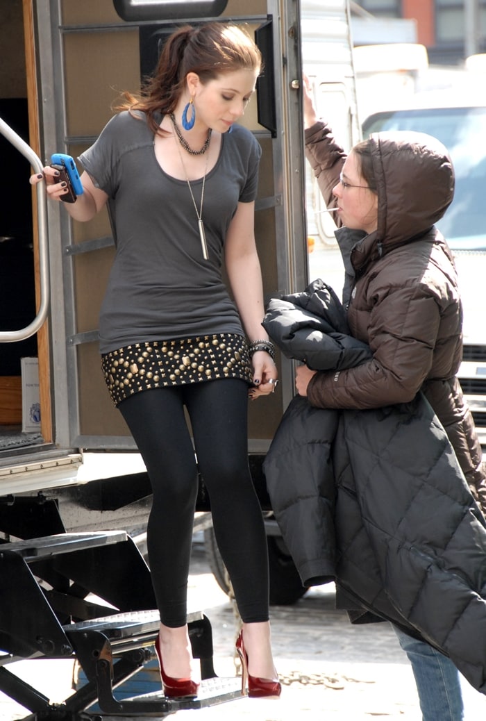 Michelle Trachtenberg exudes edgy elegance as Georgina Sparks on the set of Gossip Girl in Manhattan, New York City, on March 26, 2008, rocking a studded mini skirt, leggings, and bold red pumps