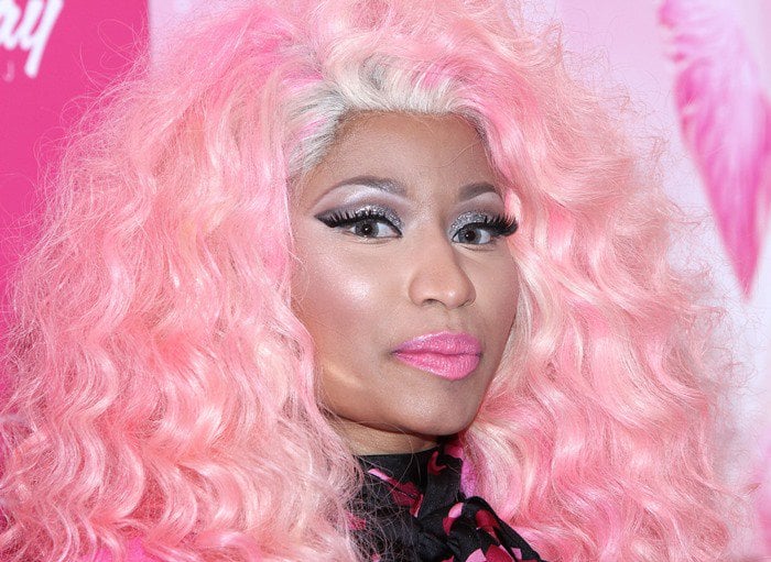 Nicki Minaj's eye-catching attire was complemented by a powder pink blonde wig and matching pink lipstick