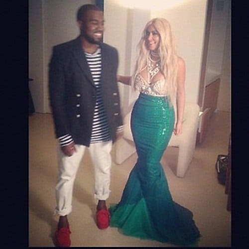 Captain Kanye West in a nautical-looking outfit and Kim Kardashian in a mermaid