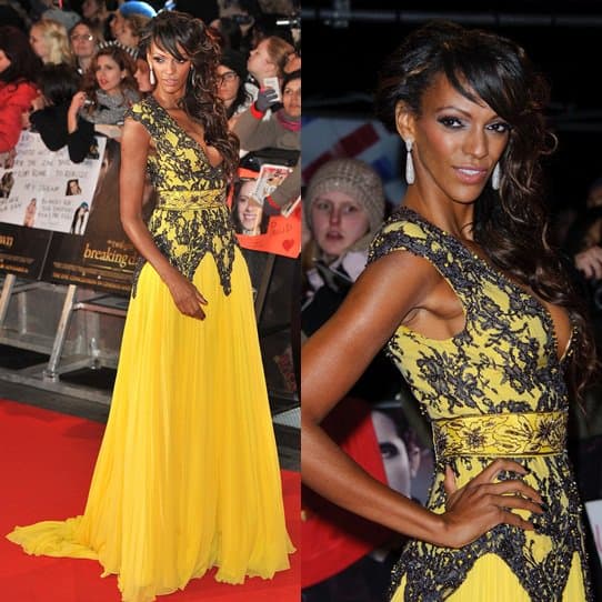 Judi Shekoni captivates in a bold black lace and yellow chiffon Chagoury Couture gown, styled with peep-toe heels at the Breaking Dawn Part 2 European premiere in London