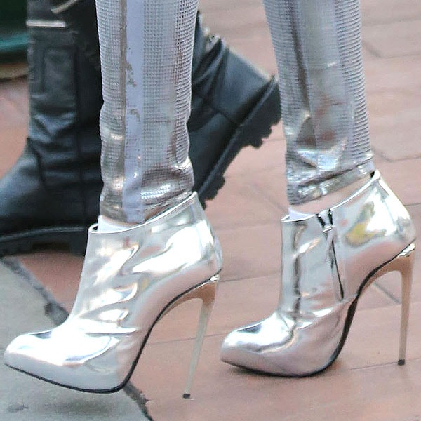 Bella Thorne's metallic Giuseppe Zanotti booties perfectly complement her shiny silver jeans