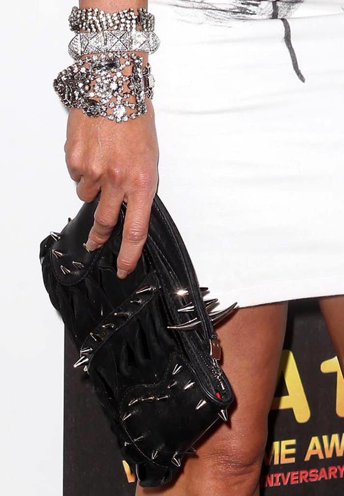 Courtney Hansen styled her dress with glittering jewelry and a spiked clutch
