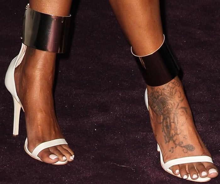 Brandy Norwood shows off her feet in metal-ankle-cuff leather sandals