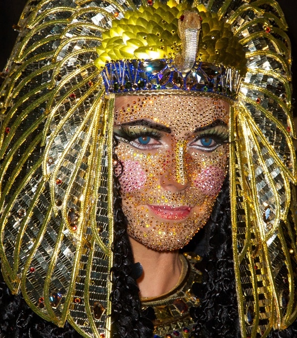 Heidi Klum wearing an elaborate headdress created with her long-time Halloween collaborator, designer Martin Izquierdo