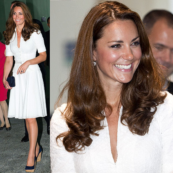 Kate Middleton looks radiant in a white eyelet belted Alexander McQueen dress, paired with navy blue platform heels and a matching clutch