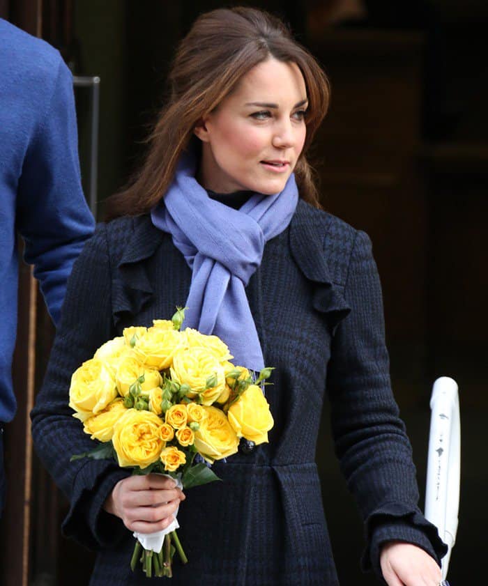 Kate Middleton emerged from the hospital in a DVF coat and holding a beautiful bouquet of yellow roses