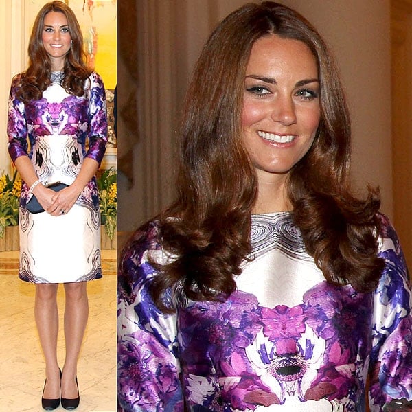 Kate Middleton makes a bold statement in a purple and white graphic print dress by Prabal Gurung, paired with black pumps, during a royal engagement in Singapore