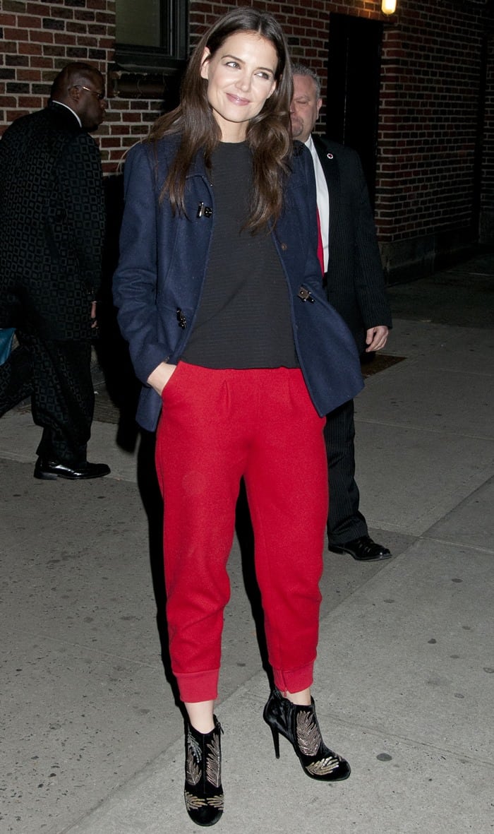 Katie Holmes wears elevated red sweatpants out in New York City