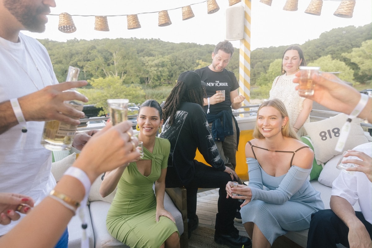 Kendall celebrated her 818 Tequila in a green Sanda Simona Studio draped mid-length dress at a rooftop party in New York