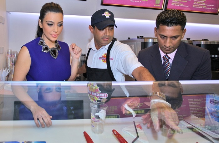 Kim Kardashian promoting her signature milkshake during a Millions of Milkshakes event in Bahrain Manama, Bahrain on December 2, 2012