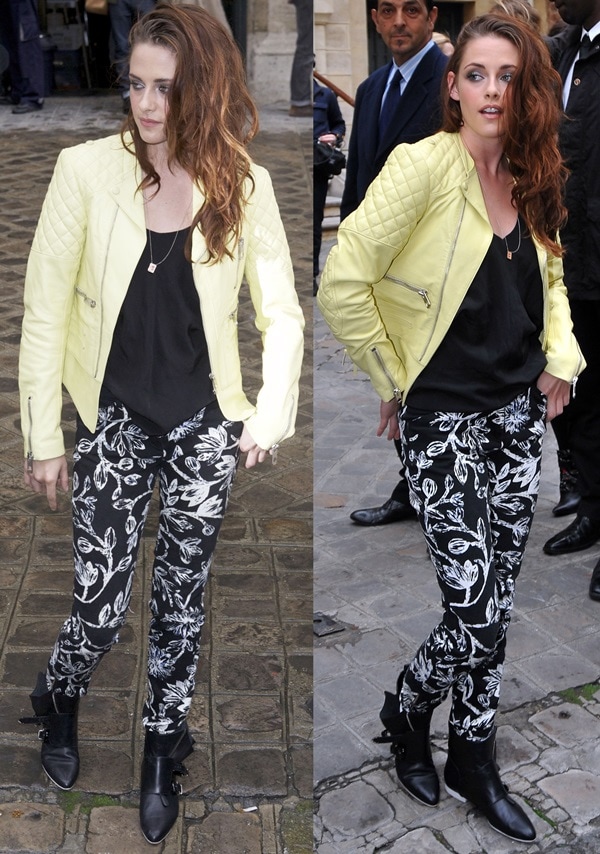 Kristen Stewart attended Paris Fashion Week on September 27, 2012, in a vibrant ensemble featuring a Balenciaga Spring 2013 Capsule Lemon New Biker Jacket, matching printed pants, and Barbara Bui leather sneakers