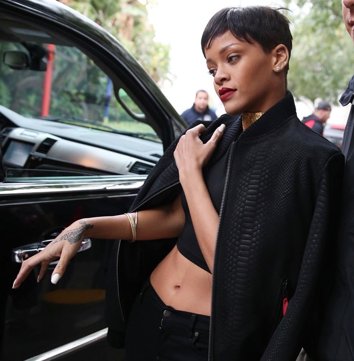 Rihanna shows off her belly button and Christian Lacroix vintage gold choker