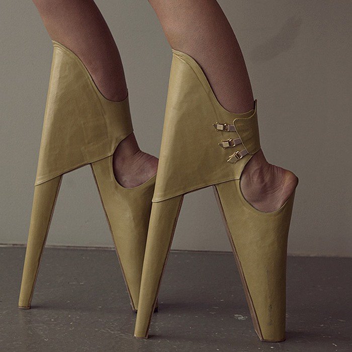 Artist Leanie van der Vyver conceptualized these shoes to be worn with the heels in front and the platform at the back